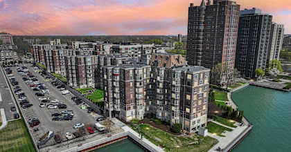 A cityscape with a river and buildings.