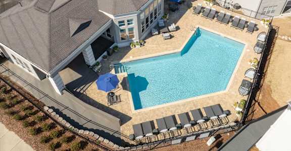 A large house with a pool in the backyard at WildForest Apartments, Birmingham, AL, 35209