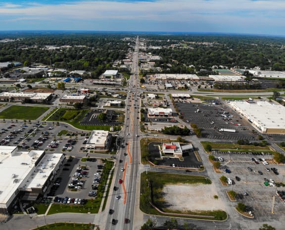 an aerial view of a busy city street with cars and buildings