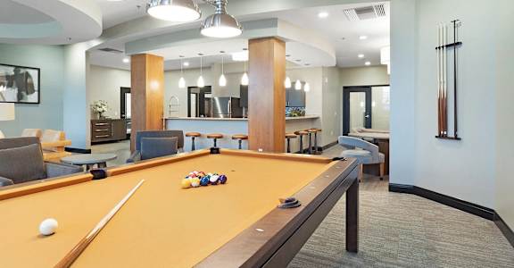 a billiards table in the clubhouse at the flats at obsidian