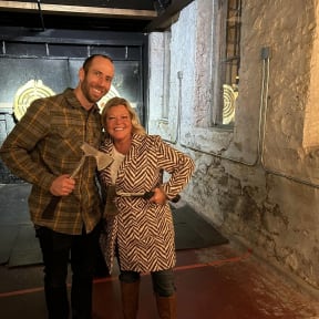 a man and a woman posing for a picture in a tunnel