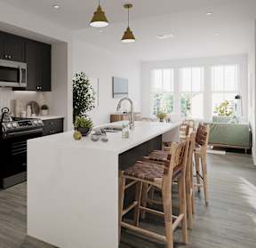a kitchen with black cabinets and a white island with chairs