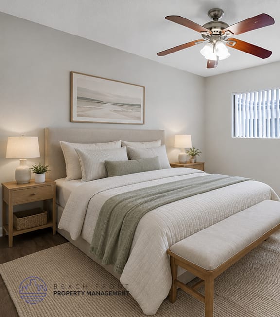 A bedroom with a bed, a bench, a ceiling fan, and a potted plant.