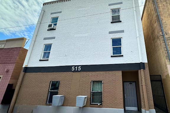 A white building with the number 515 on the side.