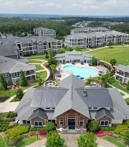 an aerial view of a large complex with a swimming pool and golf course at The Crest at Laurel Canyon, Canton, GA, 30114