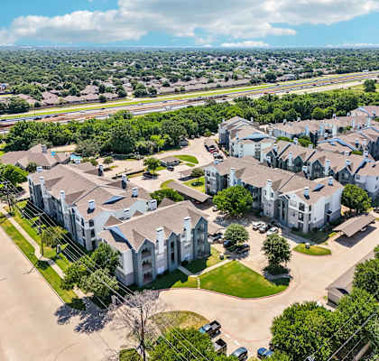 an aerial view of a neighborhood with houses and trees