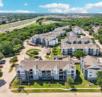 an aerial view of a neighborhood with houses and trees
