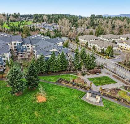 A bird's eye view of a residential area with houses and trees.