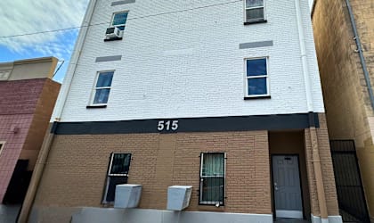 A white building with the number 515 on the side.