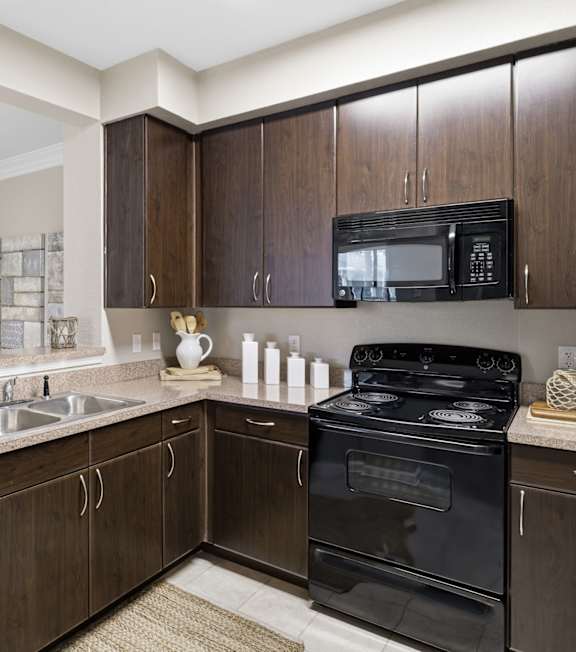 A modern dining room with a large table and chairs. at Park Place Oviedo Apartments, Oviedo, FL