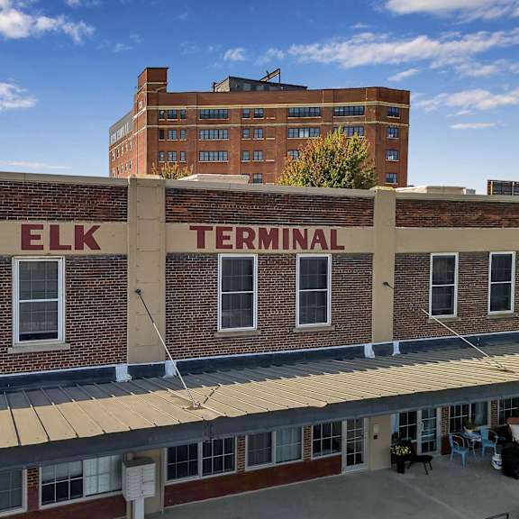 an old brick building with the word elk terminal on it at The Lofts at Elk Terminal Apartments , Buffalo, 14202