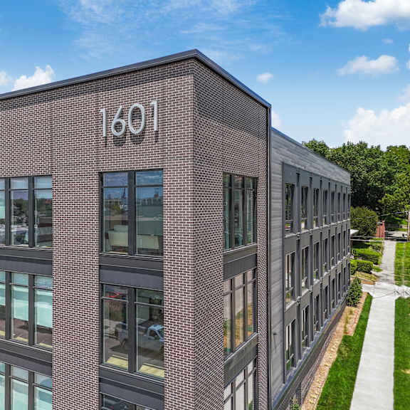 the side of a brick building with the number 1001 on it