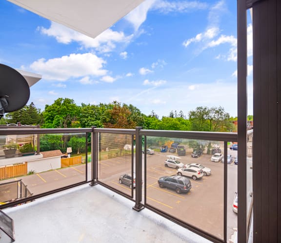 a balcony with a view of a parking lot