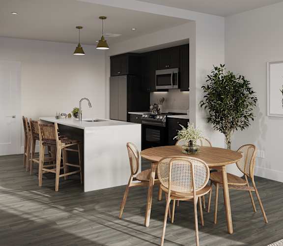 a kitchen and dining room with a table and chairs