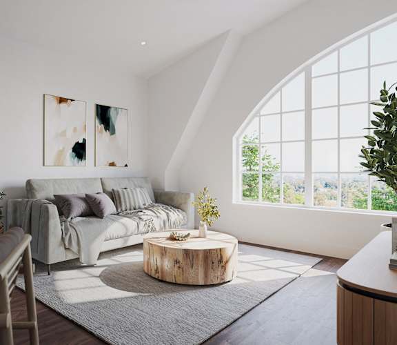 a living room with a couch and a round coffee table