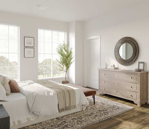 a bedroom with a bed and a dresser