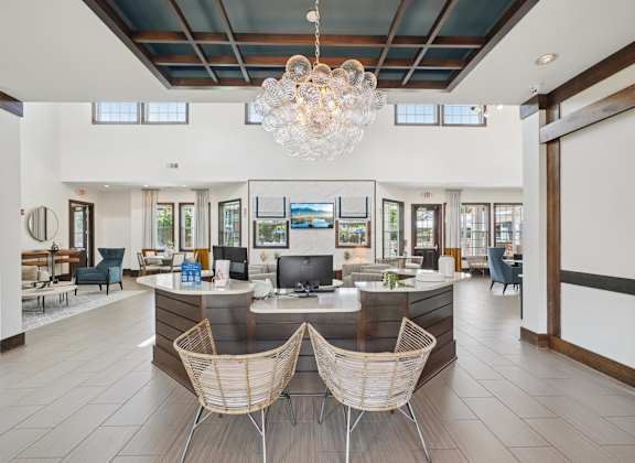 A reception area with a desk and two chairs.
