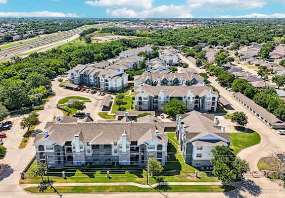 an aerial view of a neighborhood with houses and trees