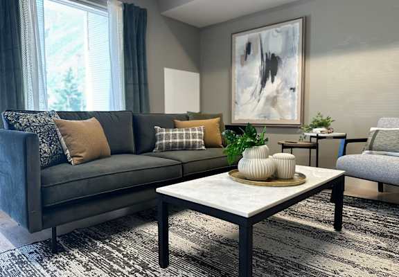 a living room with a gray couch and a coffee table at MountainView Flats, Colorado, 81601