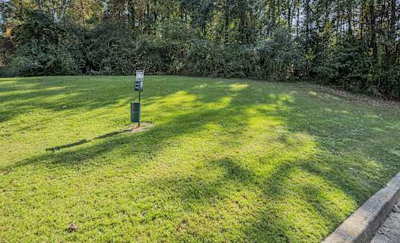 a lawn with a sign in the middle of it