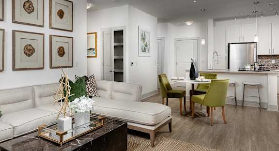 A modern kitchen and dining area with a pool table.
