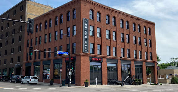 A large red brick building with the words "70th Century" on the front.