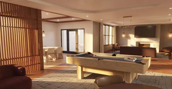 A billiard table is in the middle of a room with a red chair and a brown chair.