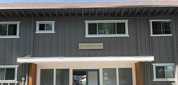 the front door of the renovated plans building