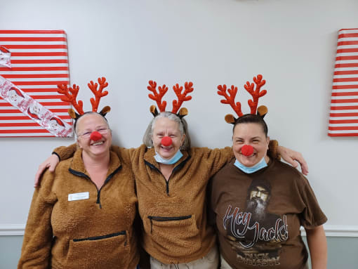 Community Staff Celebrate with Rudolph the Red-Nosed Reindeer Fun at