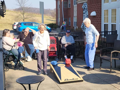 Corn Hole Games with Family at Elison Independent and Assisted Living of Maplewood