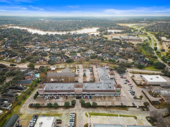 an aerial view of a city with a river in the background