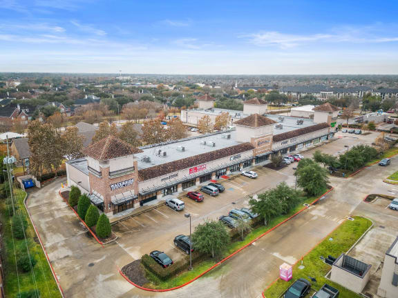 an aerial view of the building and parking lot