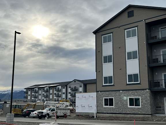 a new apartment building is being constructed on a city street