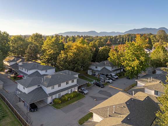 a aerial view of a neighborhood with houses and trees