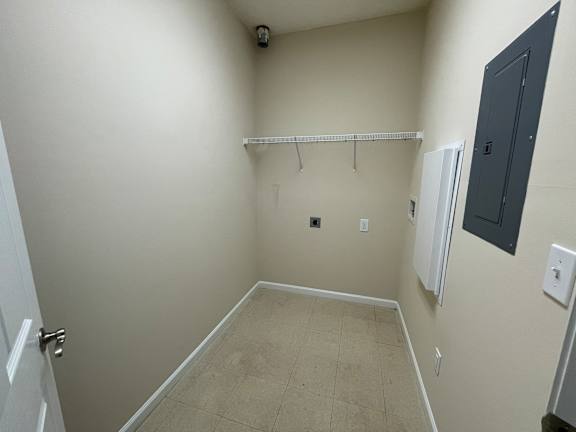 A small, empty room with a door on the left and a closet on the right. at The Legends at Steeplechase, Richwood, KY, 41094