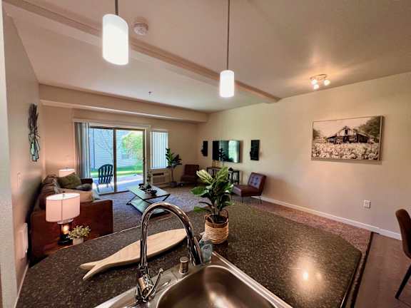 the view from the kitchen into the living room and the living area of a home  at Mullan Reserve Apartments, Missoula, MT, 59808