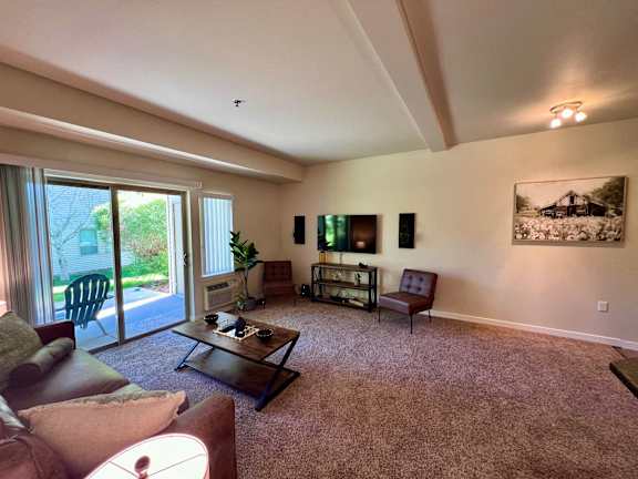 a living room with a couch and a table at Mullan Reserve Apartments, Missoula, Montana