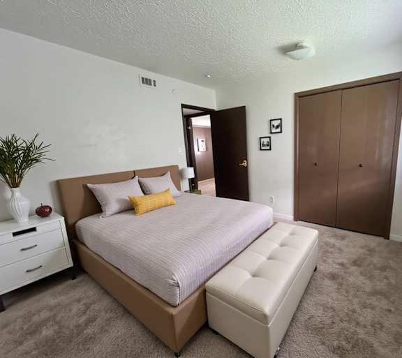 a living room with a couch and a table and a television