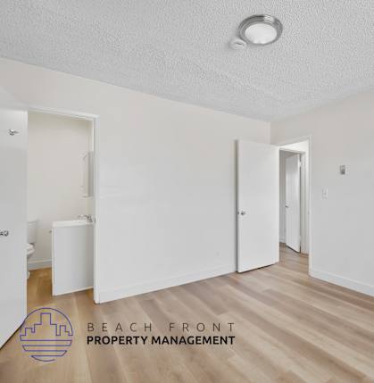 A room with a logo of Beach Front Property Management.