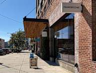 A brick building with a sign that says "FRAMEBRIDGE" on it.