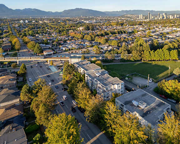 an aerial view of the campus with the city in the background