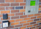 Thumbnail 22 of 23 - a brick wall with a light switch and buttons on it