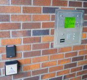 Thumbnail 22 of 23 - a brick wall with a light switch and buttons on it