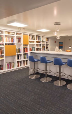 A room with a bar and a television on the wall at The Argonne Apartments, Washington DC