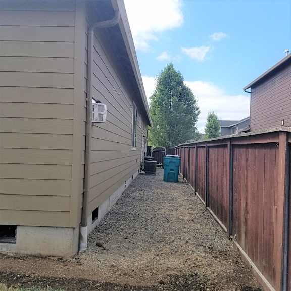a view of the side of the house from the side yard