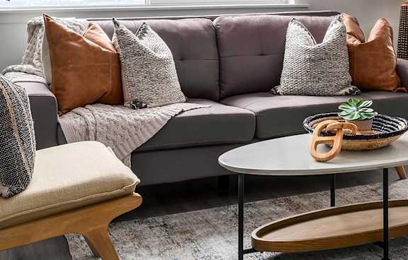Cozy couch in a living room at Rise townhomes in South Jordan, Utah