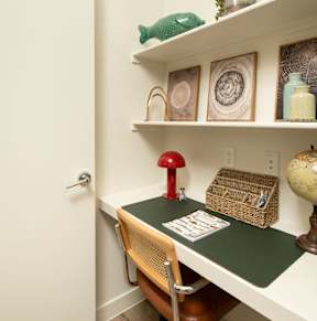 A small room with a desk and chair.