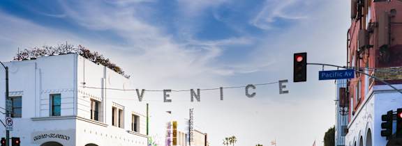 A white building with the word "Venice" written on a banner across the front.