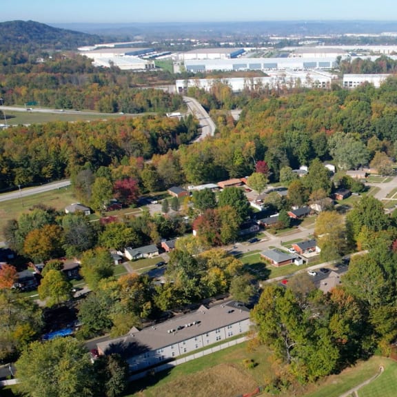 an aerial view of a neighborhood with houses and trees