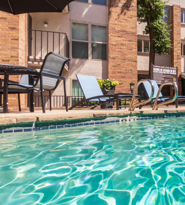 This is a photo of the primary pool area at Cambridge Court Apartments in Dallas, TX.